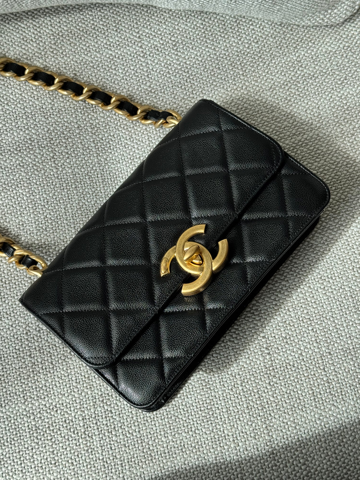Chanel 24A Flap Bag WOC – Black Grained Calfskin with Gold Hardware