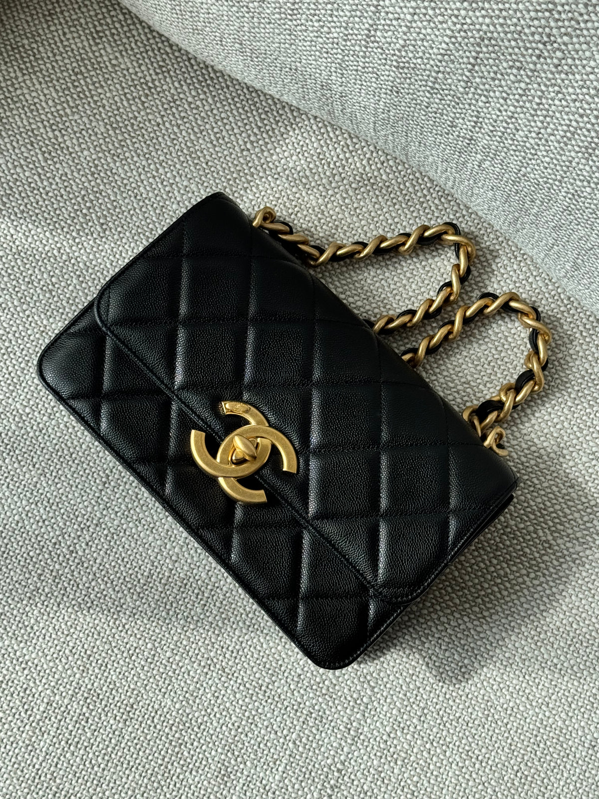 Chanel 24A Flap Bag WOC – Black Grained Calfskin with Gold Hardware